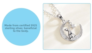 Detailed close-up of S925 sterling silver crescent moon and cat pendant with zircons