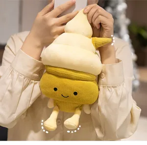 Close-up of cute plush mango ice cream pillow with smiley face and soft yellow fabric