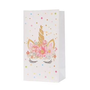 Cute white unicorn party gift bag with gold horn and pink flowers for birthday events