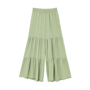 Detail of light green wide-leg trousers with elastic high waist and tiered ruffle design