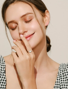Close-up of elegant S925 silver ring featuring a rectangular light blue opal on hand