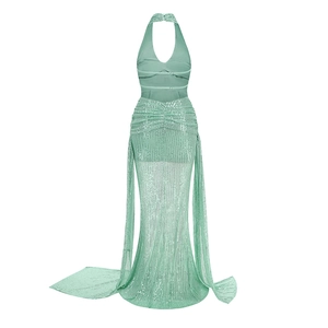Detailed close-up of mint green sequin halter dress with delicate tulle fish-tail hem