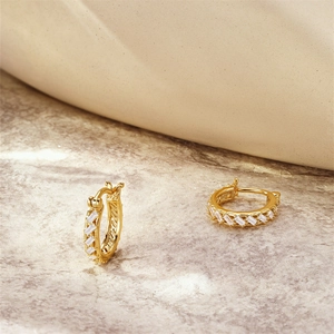 Detailed close-up of S925 sterling silver gold hoop earrings with white zircon stones