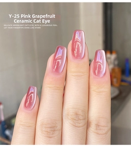 Close-up of pink grapefruit ceramic cat-eye nail polish with shiny shimmering effect