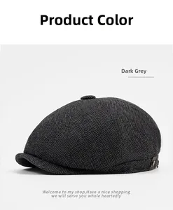 Detailed close-up of dark grey herringbone fabric texture on vintage newsboy cap