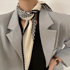 Pleated black and white striped neck scarf with a minimalist silk-like finish for women