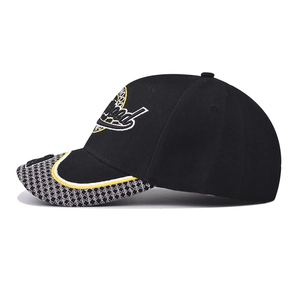 Close-up of CA letter embroidery and geometric pattern on a black baseball cap brim