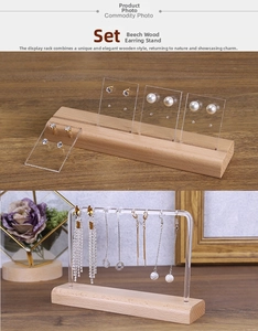 Detail of wooden base and acrylic earring display stand for studs and dangle jewelry