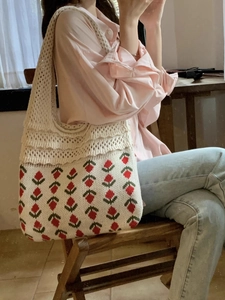 Close-up of vintage knit tote bag with floral patterns and breathable hollow mesh straps