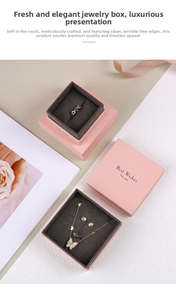 Pink jewelry gift boxes with gray velvet lining and Best Wishes text on cover
