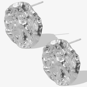 Macro view of silver 304 stainless steel stud earrings with unique irregular molten texture