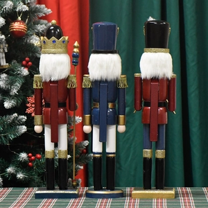 Rear view of 50cm wooden nutcracker king set with crowns and scepters by Christmas tree