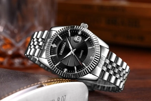 Macro detail of silver fluted bezel and black dial on premium business quartz watch