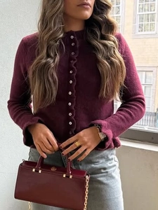 Chic burgundy knit cardigan with ruffle details and buttons for casual holiday style