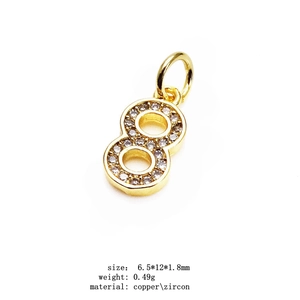 Detail of 14K gold plated number 8 pendant with cubic zirconia size 6.5x12x1.8mm