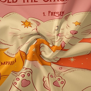 Detail of artistic cat and celestial print on soft bohemian wall tapestry fabric