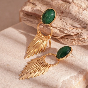 Detail of vintage gold tassel earrings featuring an oval green malachite stone inlay