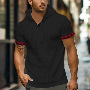 Men's black hooded short sleeve t-shirt featuring waffle texture and red plaid sleeve detail