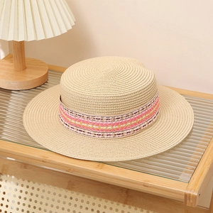 Flat top straw sun hat in beige with ethnic style embroidered band for beach vacations