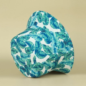 Double-sided bucket hat featuring tropical palm leaf print and wide sun-protective brim