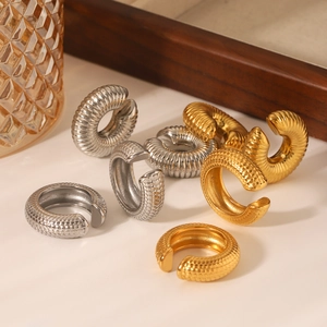 Minimalist C-shape stainless steel ear cuffs with scale and ribbed textures in gold and silver