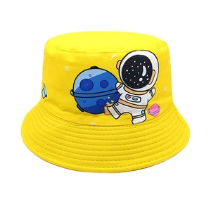 Detail of yellow canvas kids bucket hat with cartoon astronaut and blue planet print
