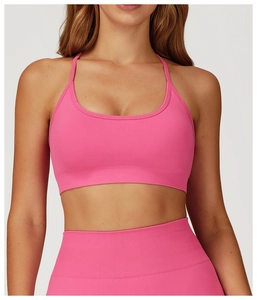 Detail of hot pink seamless yoga bra and leggings with wide ribbed supportive waistband