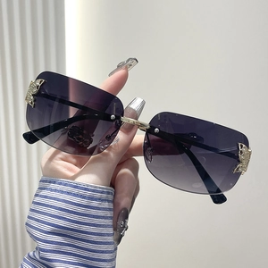 Frameless Y2K butterfly sunglasses with purple gradient lenses and rhinestone metal details