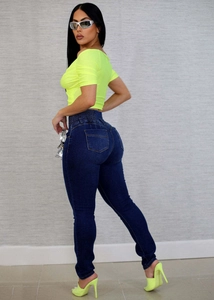 Detail of high waist slimming denim jeans featuring lift-up hip design and skinny fit