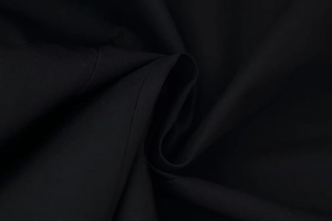 Close-up of premium black woven fabric texture with matte finish and durable stitching