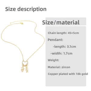 Detail view of gold heart pendant with zircon and boy-girl figures on 45+5cm chain