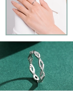 Macro detail of a twisted s925 silver ring featuring shimmering pavé micro-inlaid stones