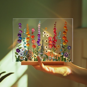 Detail of colorful floral pattern on acrylic desktop ornament with wooden base