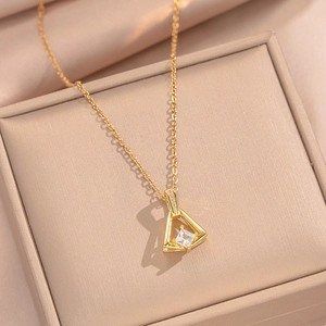 Elegant gold skirt pendant necklace with white zircon in a beige jewelry gift box