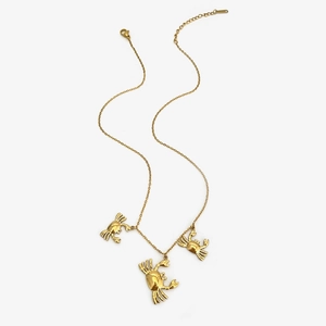 Minimalist gold titanium steel necklace featuring three polished crab pendants on a slim chain
