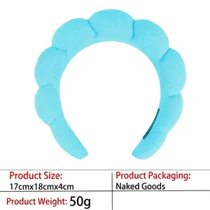 Detail view of sky blue spongy spa headband showing 17cm x 18cm dimensions and wave shape