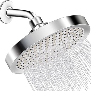 Polished chrome high-pressure round shower head with dense silicone nozzles in silver