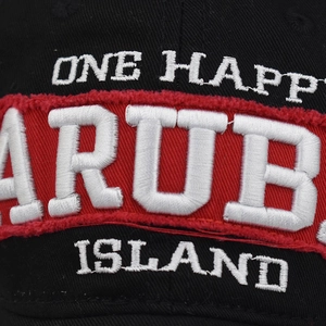 Macro view of detailed Aruba Island embroidery on black cotton washed baseball cap