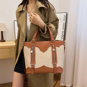 Two-tone large capacity tote bag in brown and cream leather with detachable shoulder strap