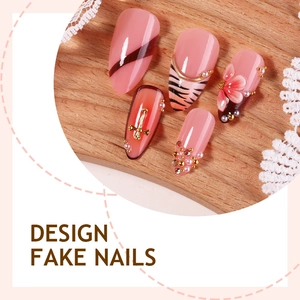 Handmade leopard print fake nails with 3D floral accents and gold cross pearl charms