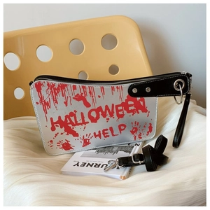 Detail of silver Halloween cleaver bag featuring red blood prints and help text