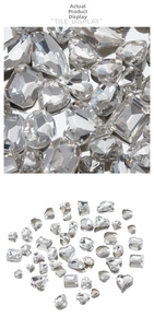 Macro detail of various shaped clear rhinestones including heart and drop cuts for nail art