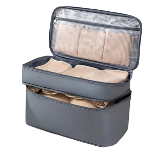 Gray multi-layer travel underwear storage bag with waterproof fabric and mesh pockets