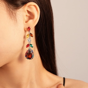 Detailed close-up of zircon leaf water drop earrings with colorful gemstones and crystals