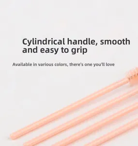 Close-up of pink cylindrical handle on disposable spoolie brush for easy grip and control