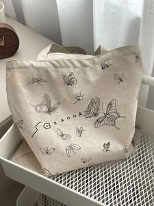 Borsa tote in tela bianco sporco con stampe di farfalle e ampia capacità per uso quotidiano