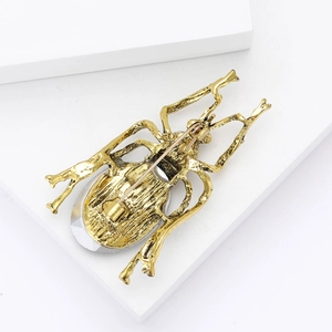Detailed back view of vintage beetle brooch showing alloy structure and secure pin clasp
