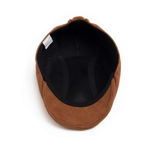 Brown faux suede newsboy cap featuring interior black lining and quality stitching