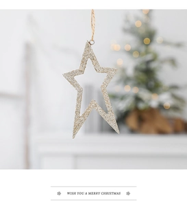 Detail of golden glitter star ornament with jute rope for Christmas tree decoration