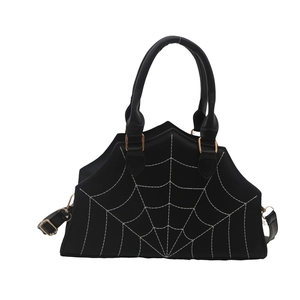 Fashion spider web handbag with gold hardware and removable shoulder strap on white background